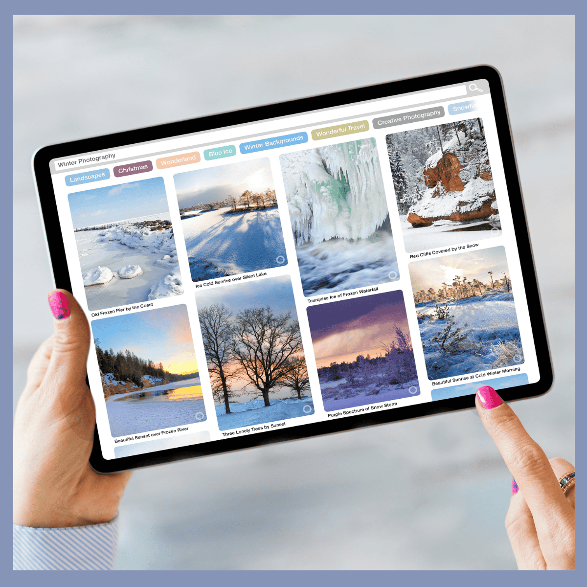 Woman browsing winter landscape photos on tablet for inspiration.