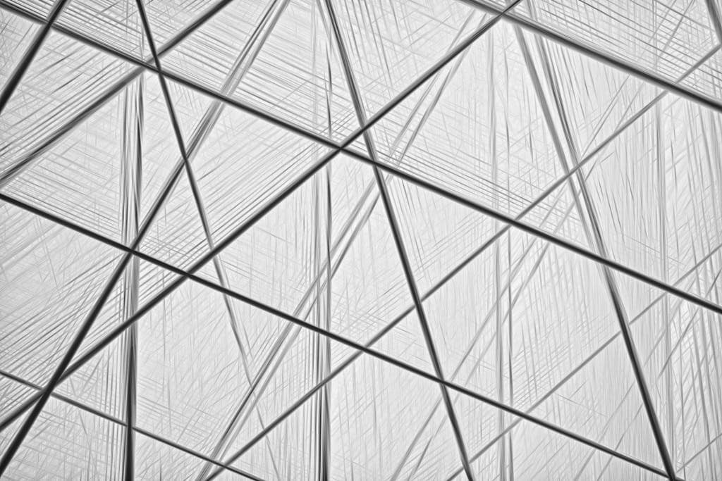 Intricate abstract architectural image with intersecting geometric lines and shapes, embodying modern minimalism.